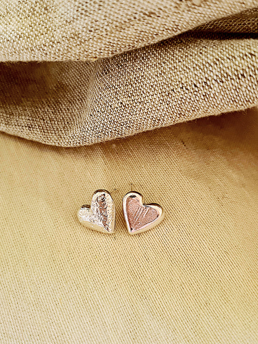 Asymmetrical stud heart earrings Silver