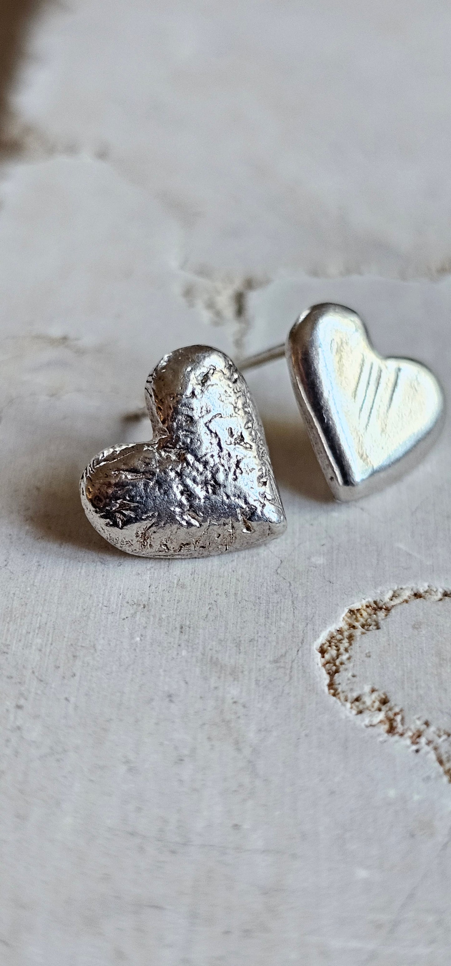 Asymmetrical stud heart earrings Silver